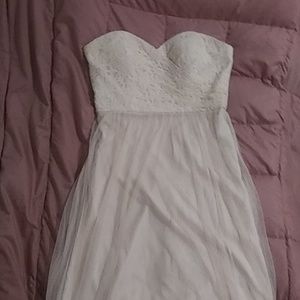 A light pink long dress with lace at the top.